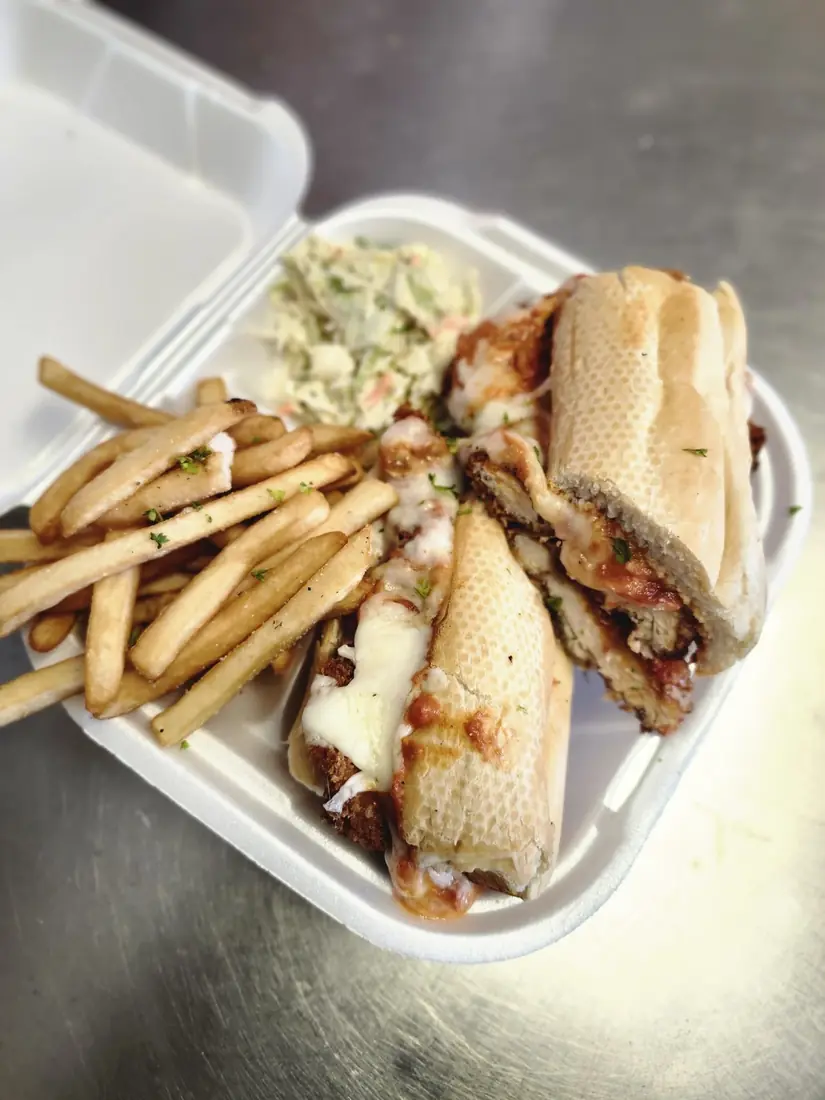 Original Chicken Parm sandwich with fries and slaw