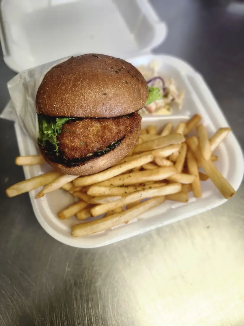 Fried Mahi Delight sandwich with fries and slaw